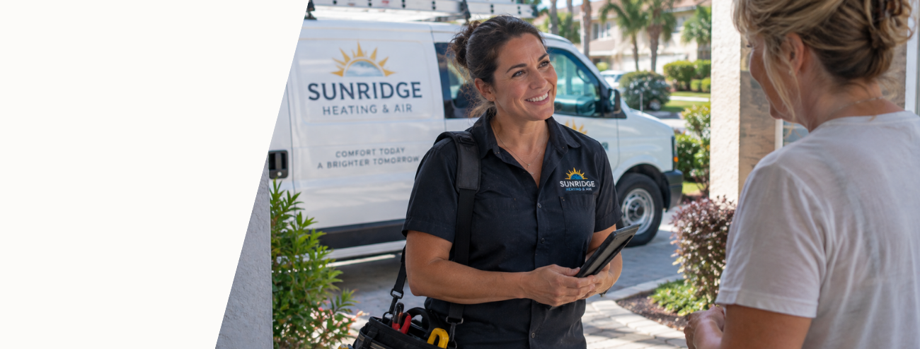 HVAC professional speaking with a homeowner during a residential service visit