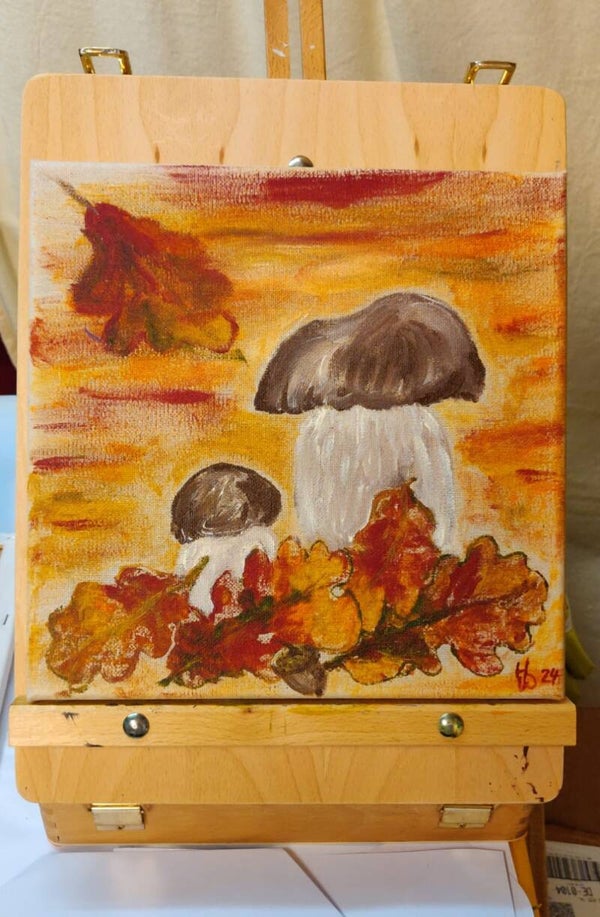 Steinpilze im Herbstlaub