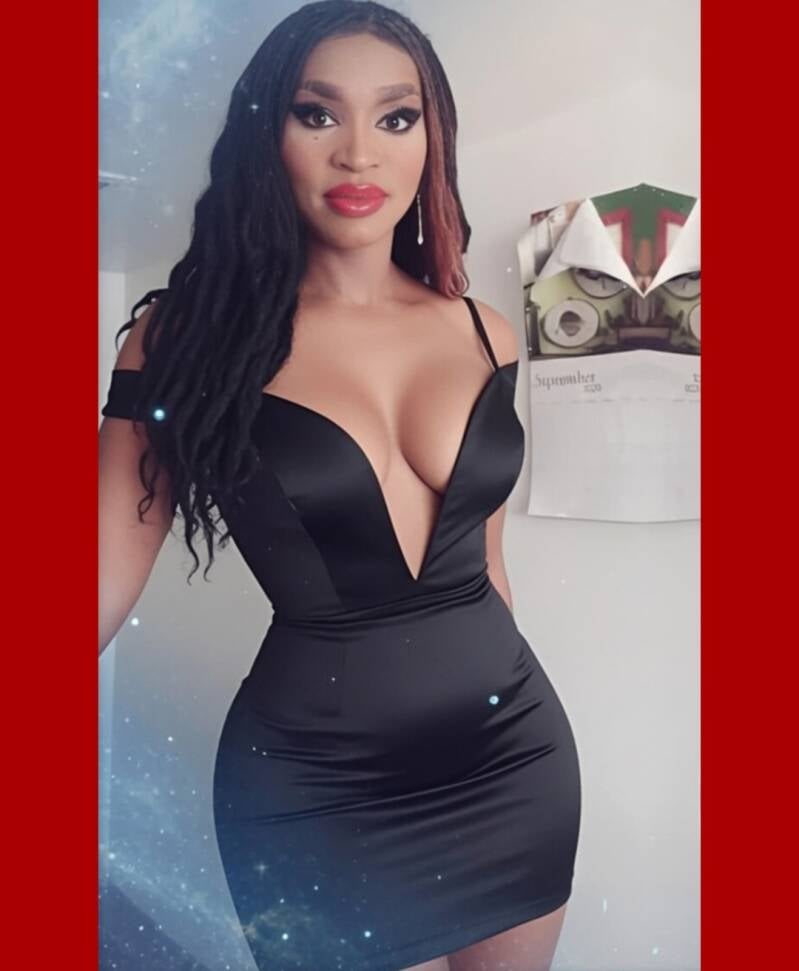 Hot transgender wearing black dress posing for pic in little black dress. Bring high fashion and business into website meet the team photo.