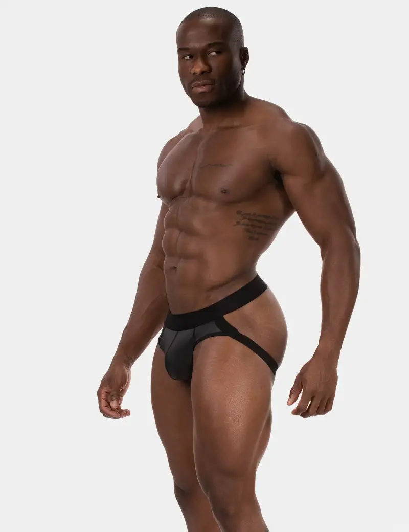 Stunning side view of fit body with defined muscle definition wearing jock strap revealing side butt cheek, as models them.