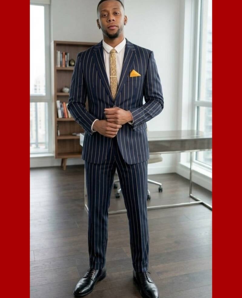 Hot black guy full image in pin stripped business suit staring confidently at the camera.