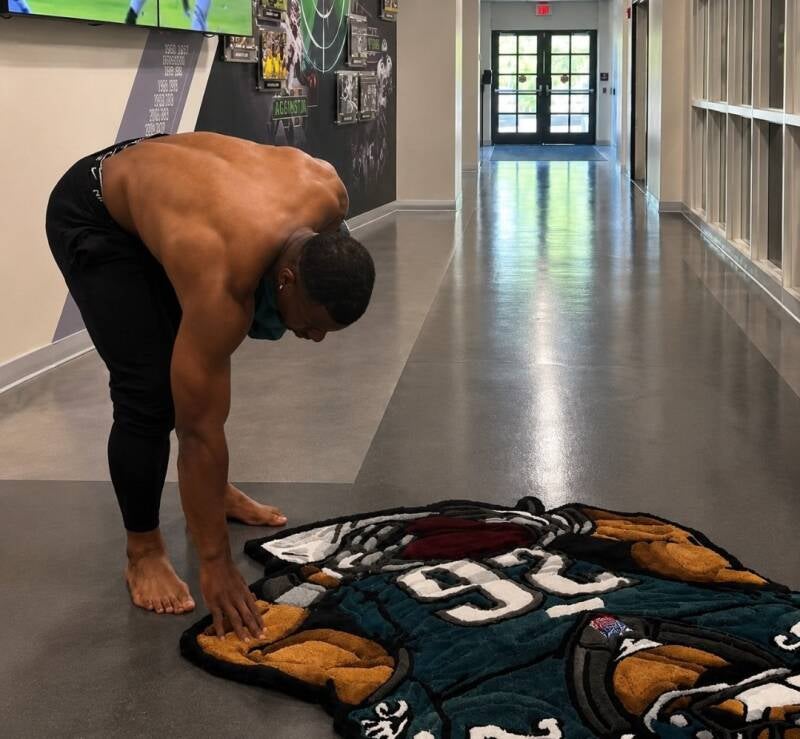 Saquon Barkley shirtless toes out on display.