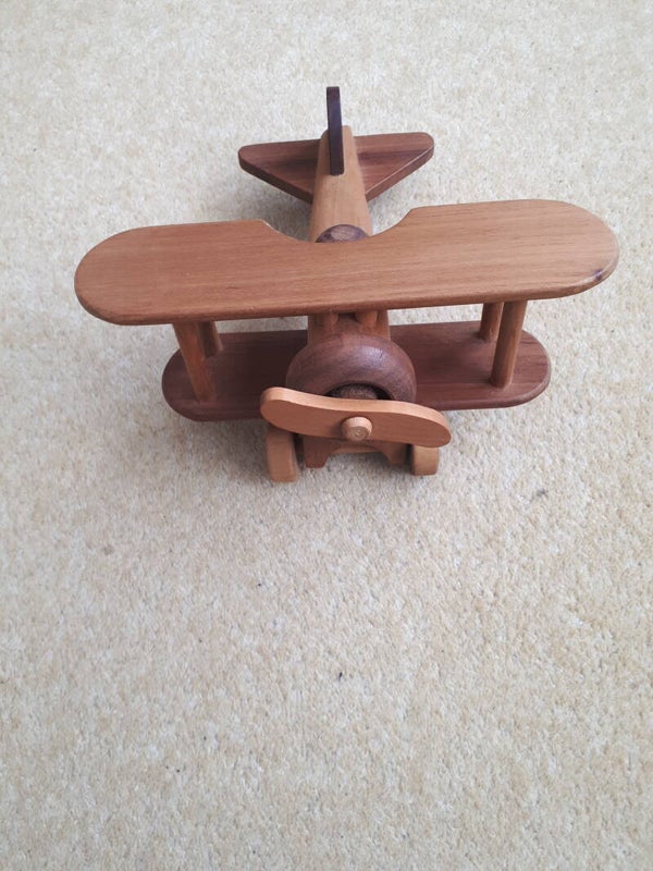 SOLD SOLDHand crafted wooden plane with moving propeller and wheels. ##