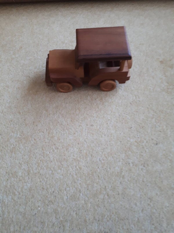 Hand crafted wooden model Safari Jeep with moving wheels.##