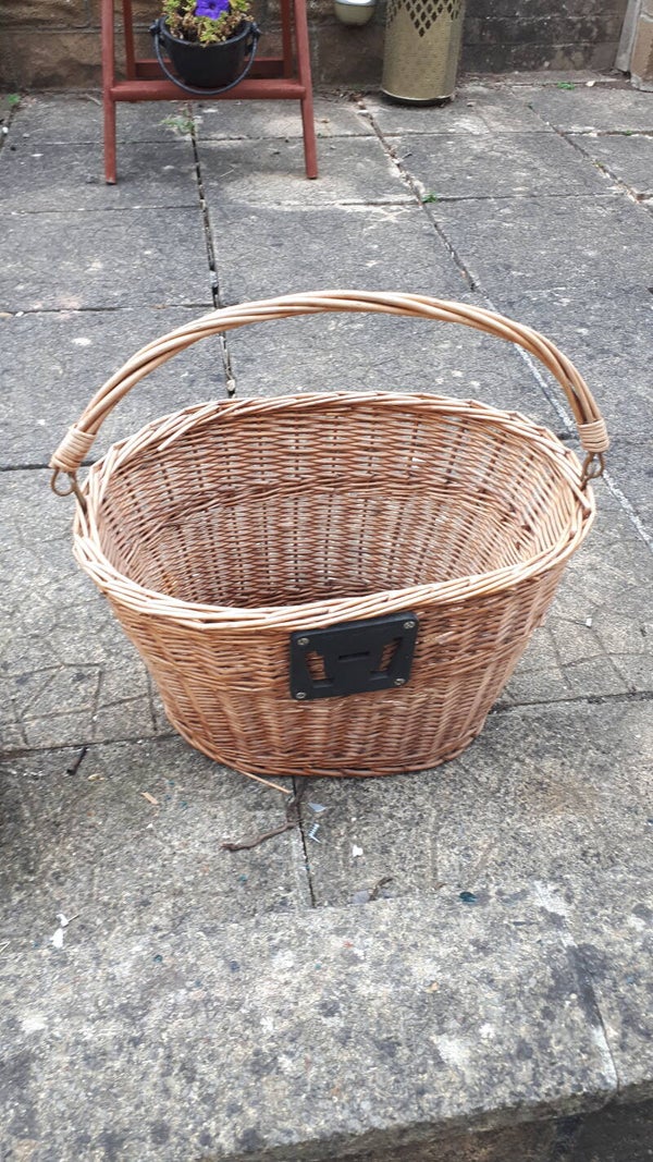 SOLD SOLDWicker basket with moveable handles . Collection only Caerleon nr Newport Gwent