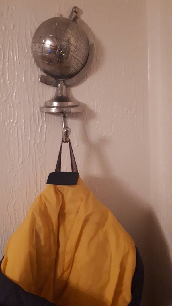 SOLD SOLD Quirky metal half globe shape with coat/ hat hook.