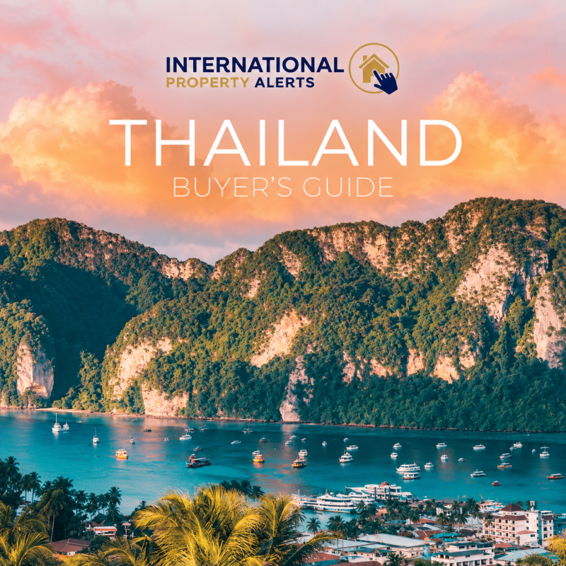International Property Alerts Thailand Buyer’s Guide cover, featuring a tropical bay with boats, limestone cliffs and a peach-coloured sky.