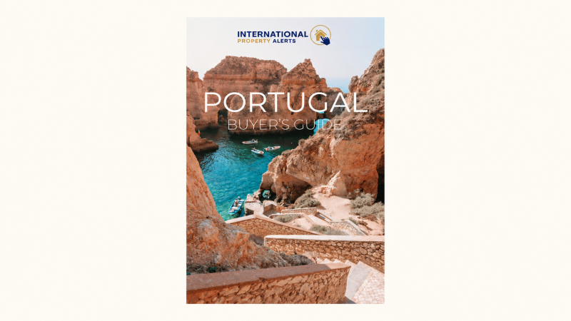 International Property Alerts Portugal Buyer’s Guide featuring Algarve cliffs and turquoise water.