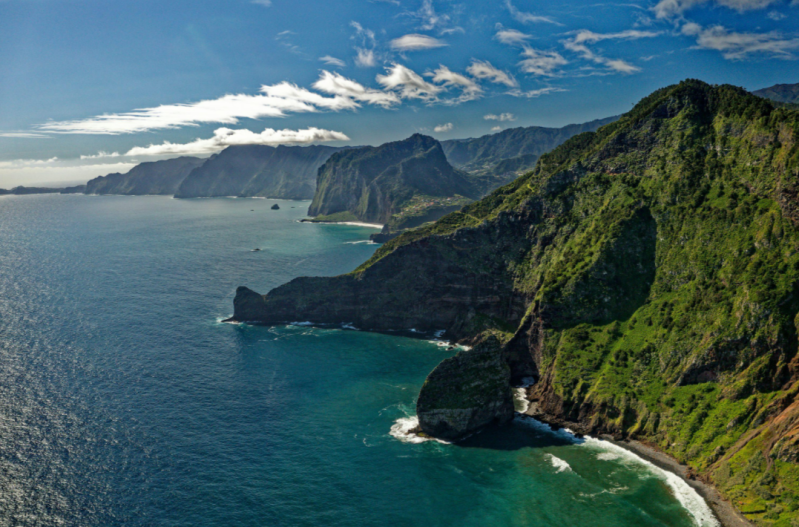 Green mountains and dramatic Atlantic coastline on Madeira, Portugal.