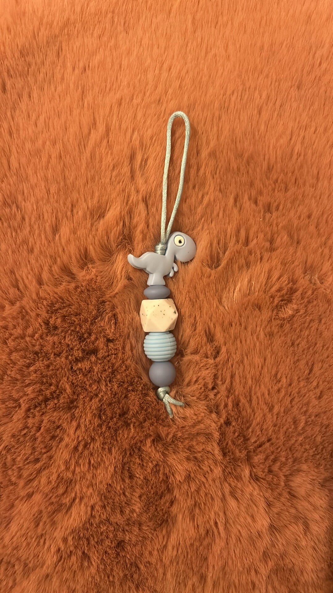 Jaszipper met een Dinosaurus