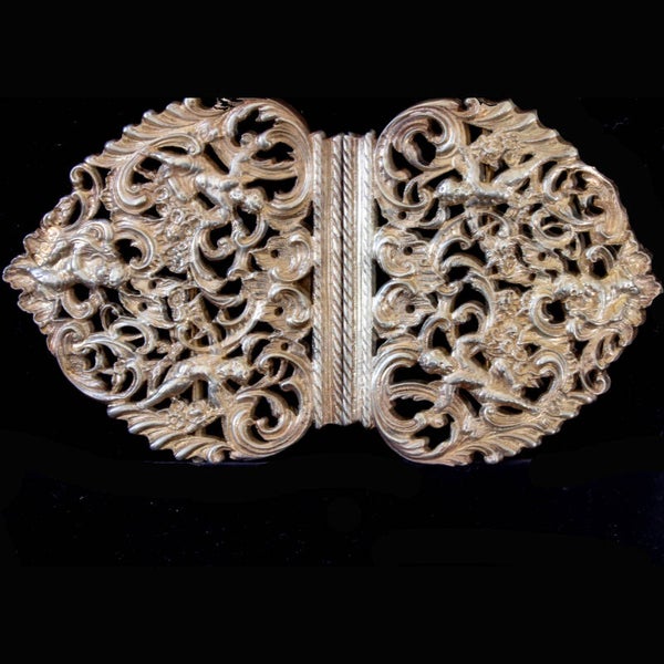 Antique Sterling Silver nurses belt buckle featuring cherubs