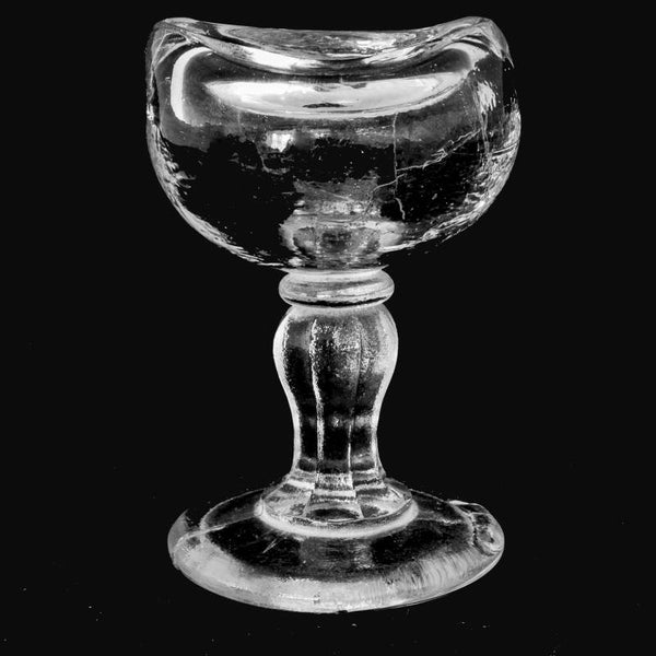 Antique clear glass eye-wash bath, John Bull shape