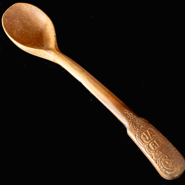 Antique hand-carved spoon with excellent detailed carved decoration.
