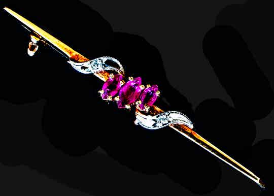 Marquise cut rubies and round diamonds on a 9 carat gold bar brooch