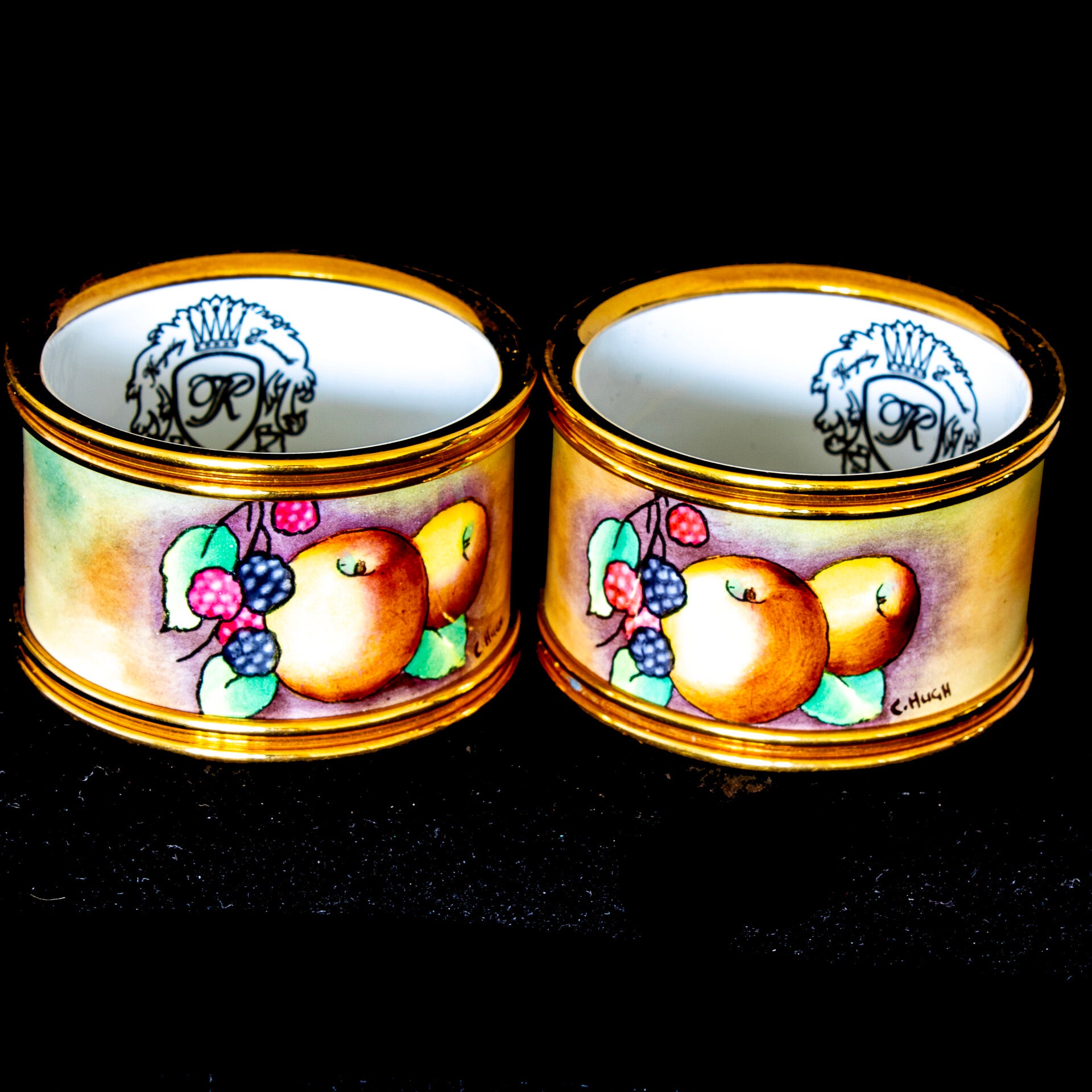 Vintage pair of porcelain napkin rings, hand enameled and signed by artist