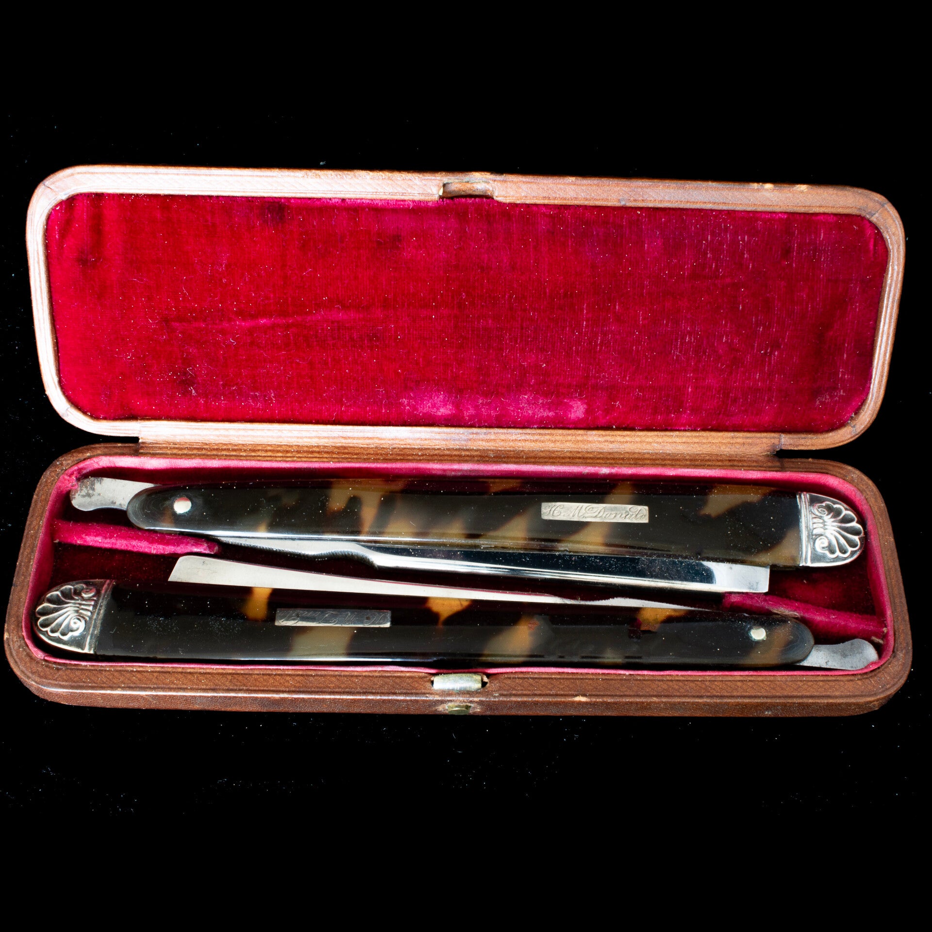 Cased set of mid 19th century straight razors.