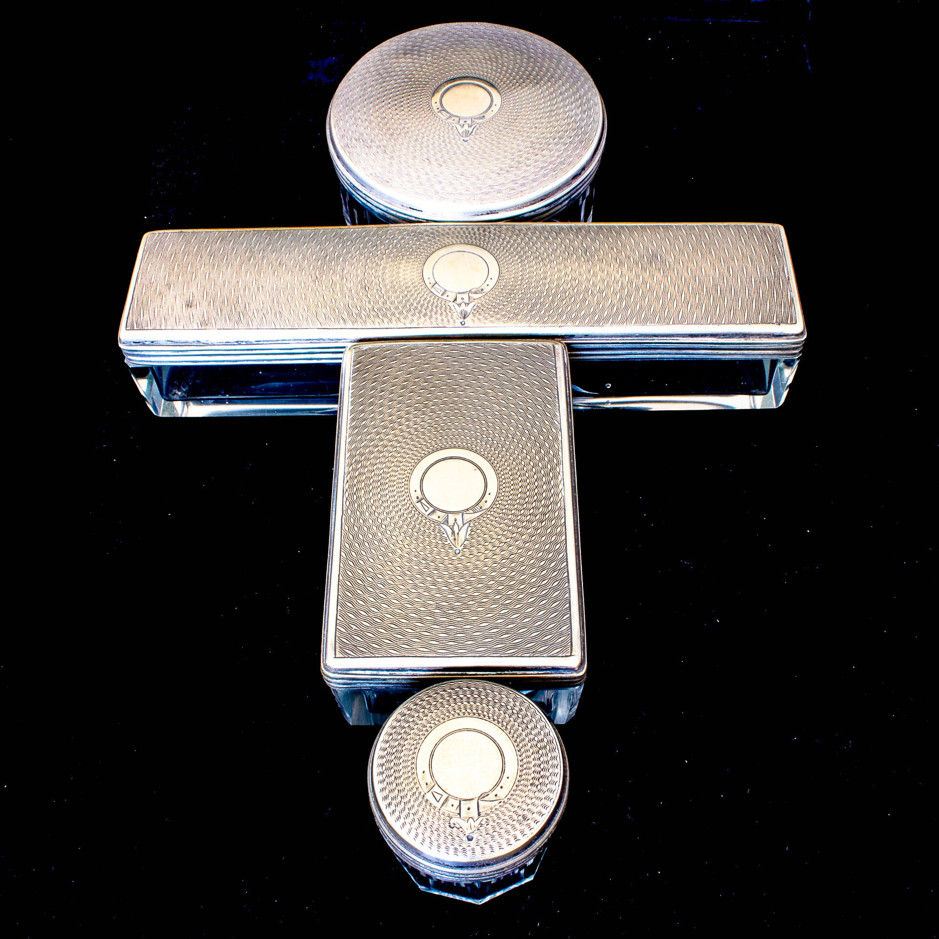 4 heavy glass and metal lidded containers for the dressing table