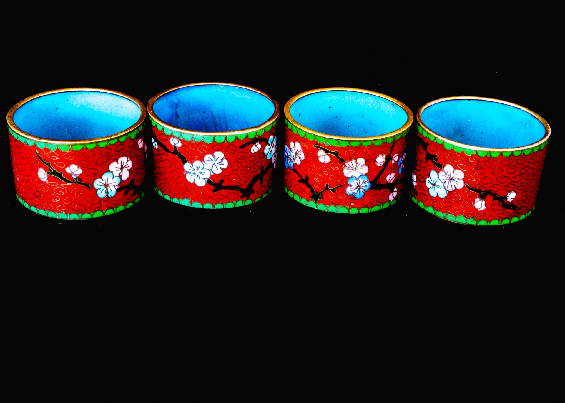 Set of 4 brass napkin rings with cloisonne decoration
