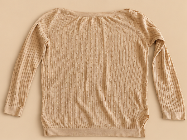 Pull beige en maille torsadée