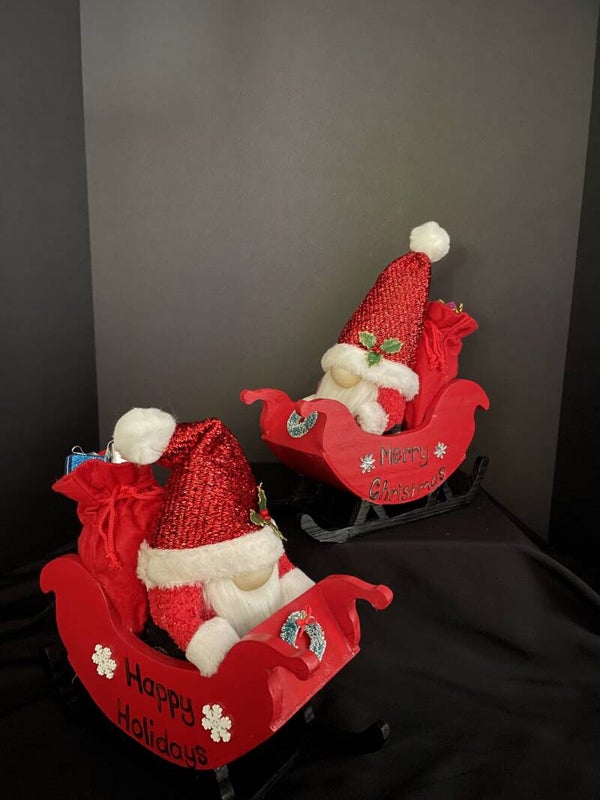 santa gnome in a sleigh