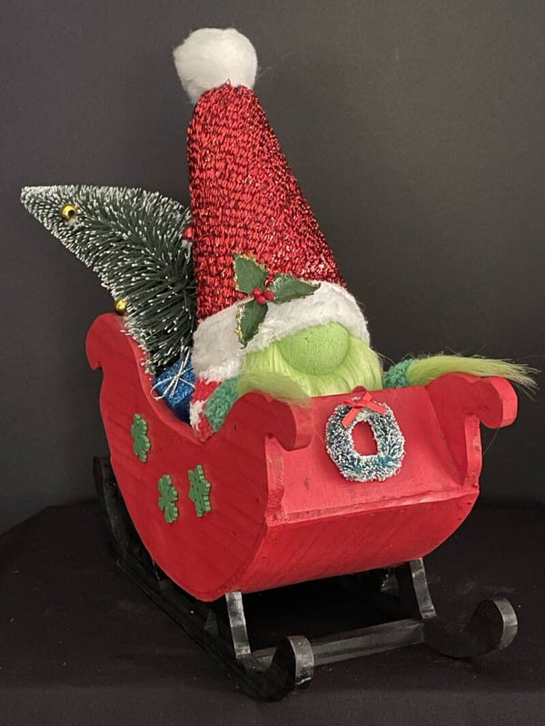 grinch gnome in sleigh stole gifts and gifts