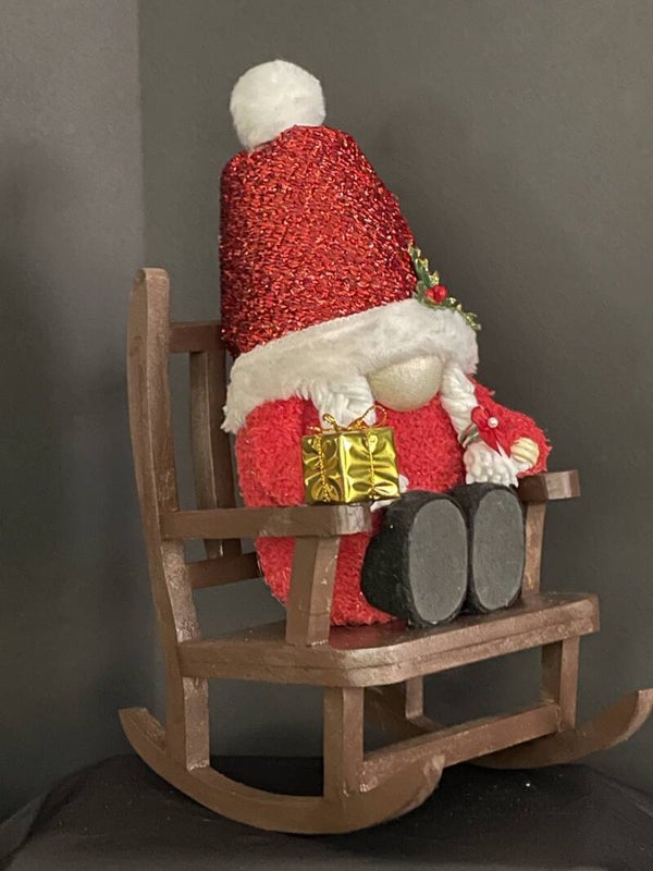 mrs. clause in rocking chair