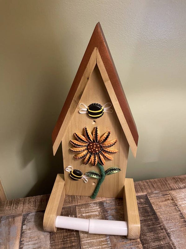 orange bottle cap toilet paper dispenser