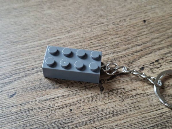 Sleutelhanger : Grijs Bouw Blokje !!
