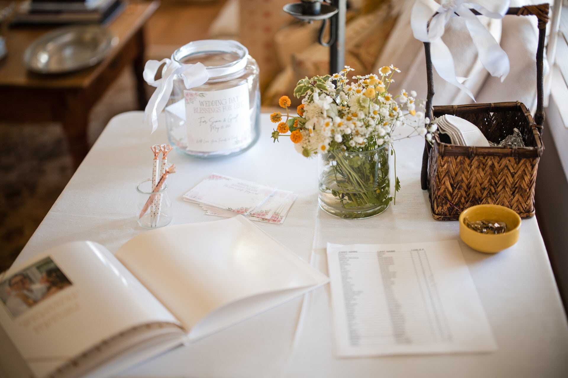 A wedding guest list and floral arrangement representing personalized marriage ceremonies and unions.