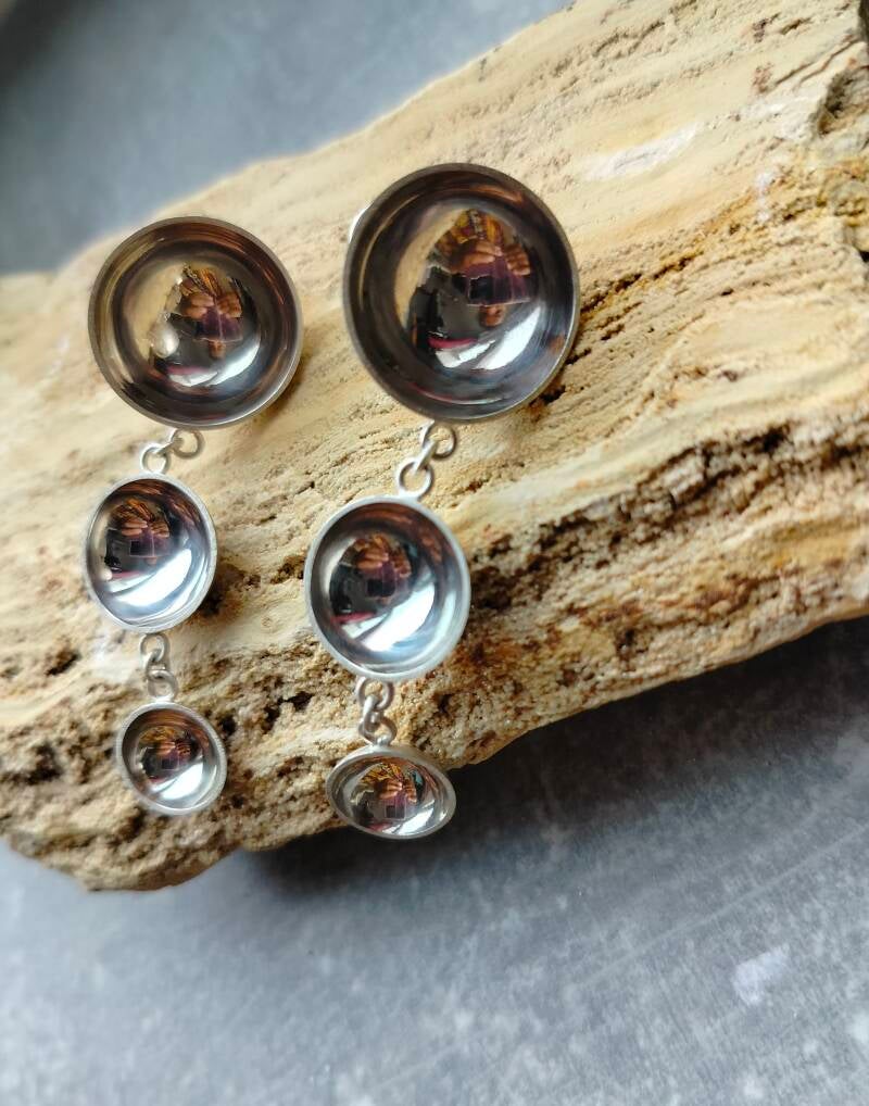 Sculptural sterling silver drop earrings from the Held Light collection