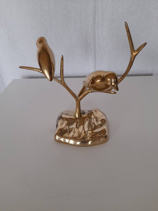 Oiseaux en laiton sur une branche