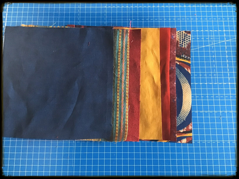 Layering fabric scraps for slashing project