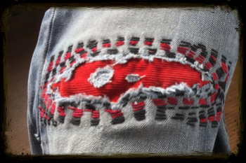 Visible mending. Underpatch running stitch.