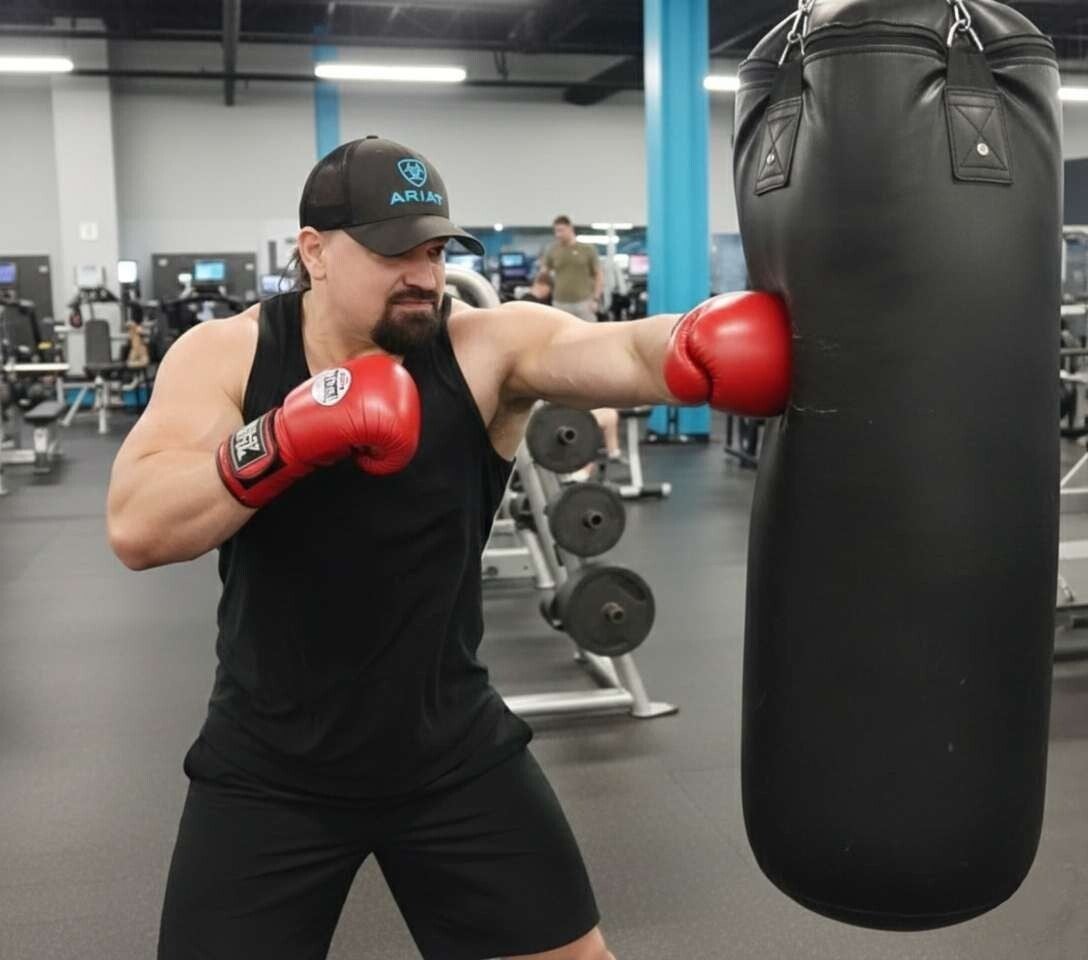 Picture of Black Scorpion Ninjutsu Society Founder Bobby Calvert AKA Ninja Bob punching a punching bag. 