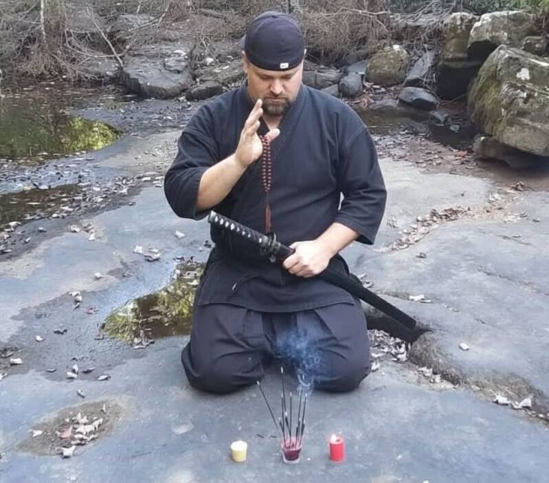Photo of Ninja Bob meditating 