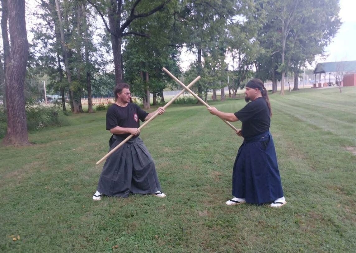 One-on-one personalized martial arts and weapon defense instruction outdoors