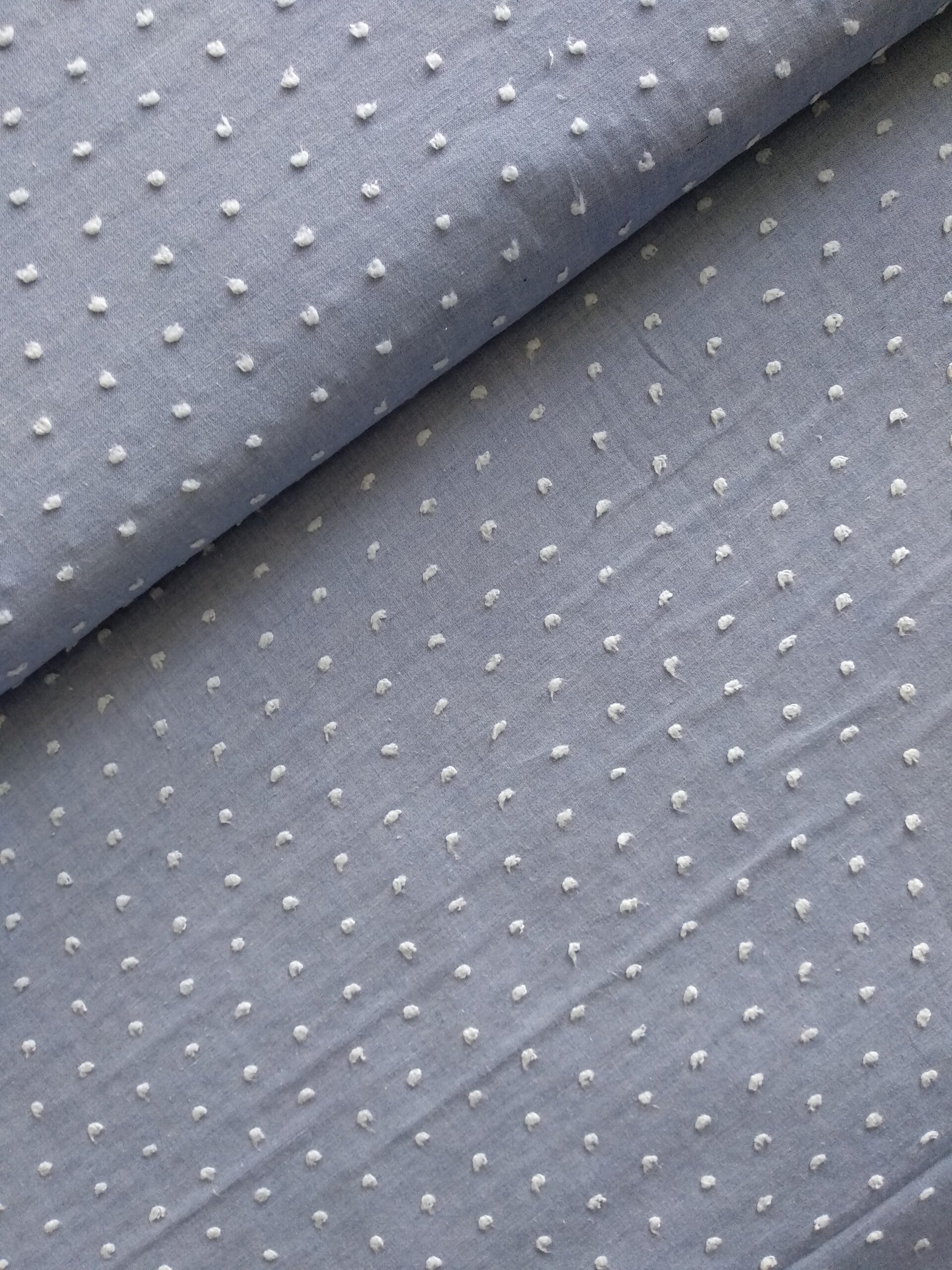 Blauw katoen met wit pluisje 