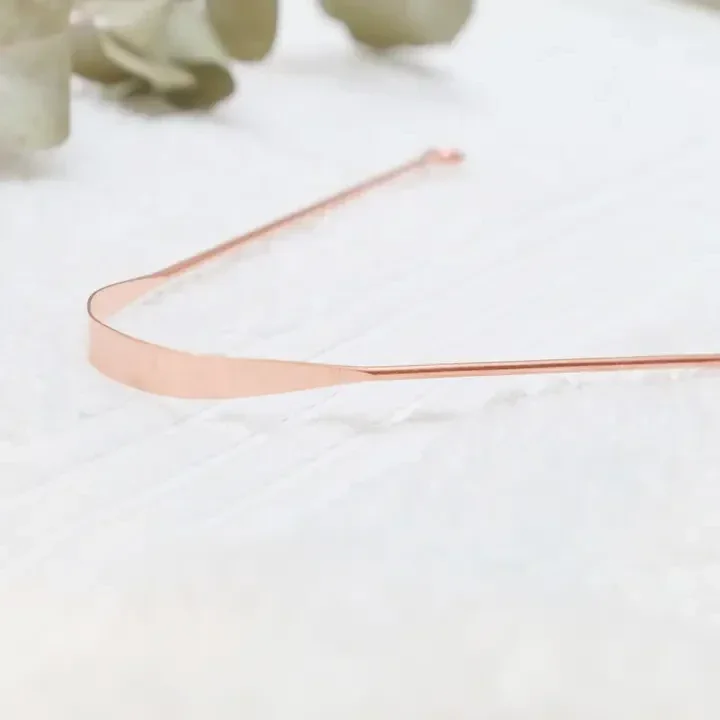 Koperen tongschraper