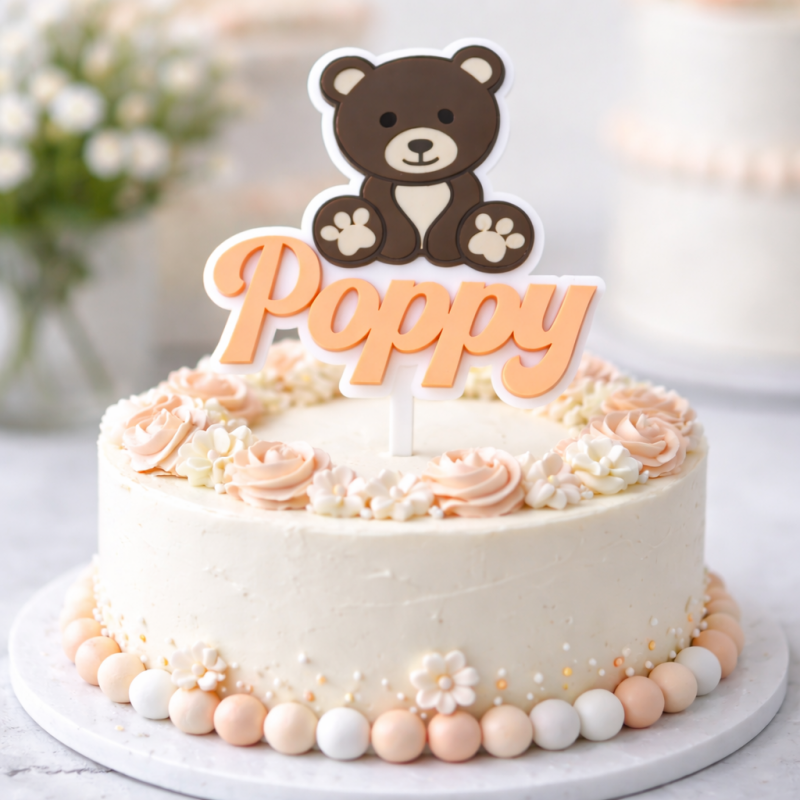 Personalised teddy bear cake topper with name on baby celebration cake UK