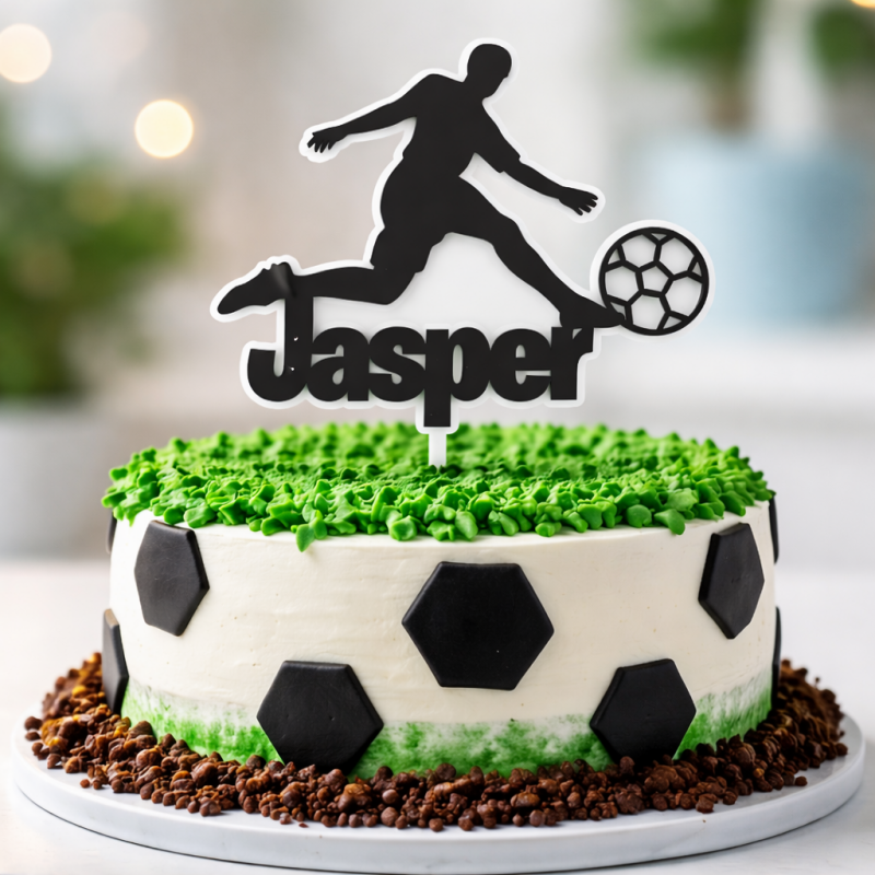 Personalised football player cake topper with name on black and white birthday cake UK