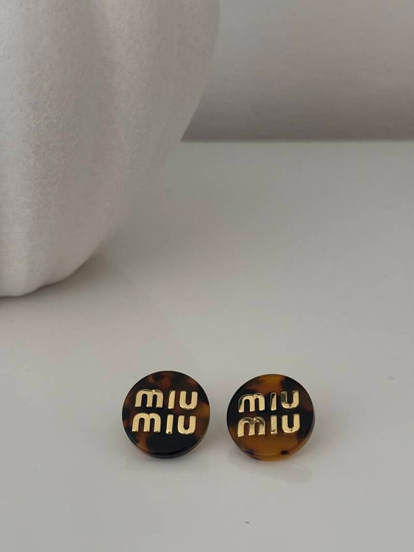 Orecchini a bottone miu maculato