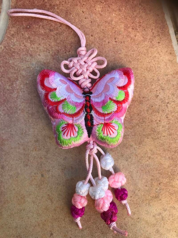 Lucky charm from Nepal pink butterfly