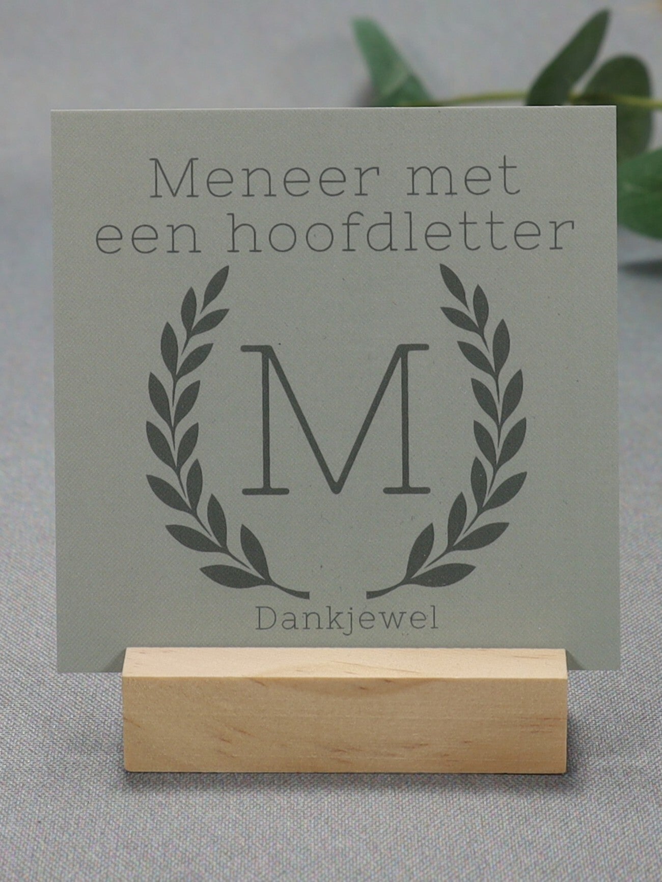 K | Meneer met een hoofdletter M