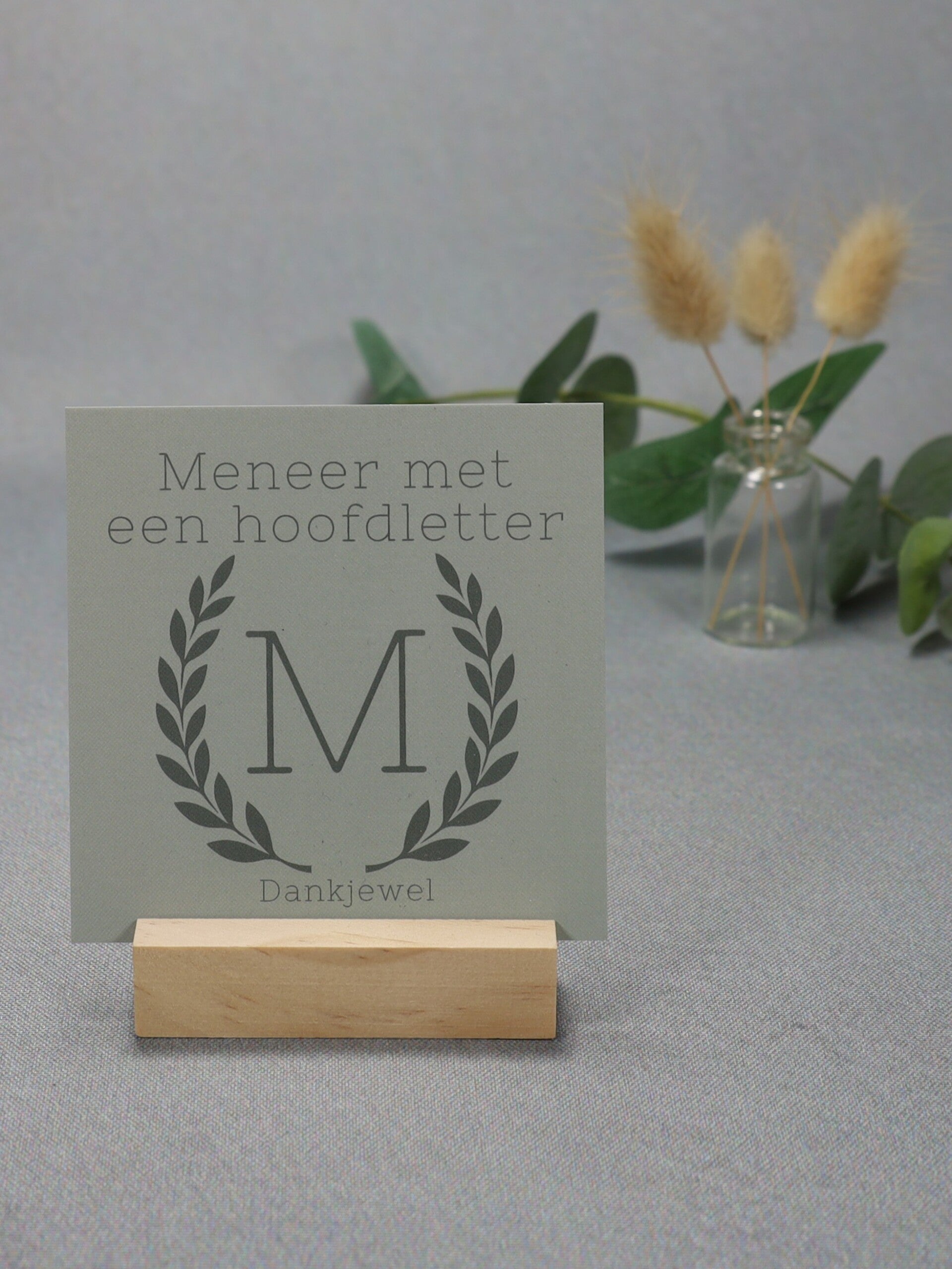 K | Meneer met een hoofdletter M