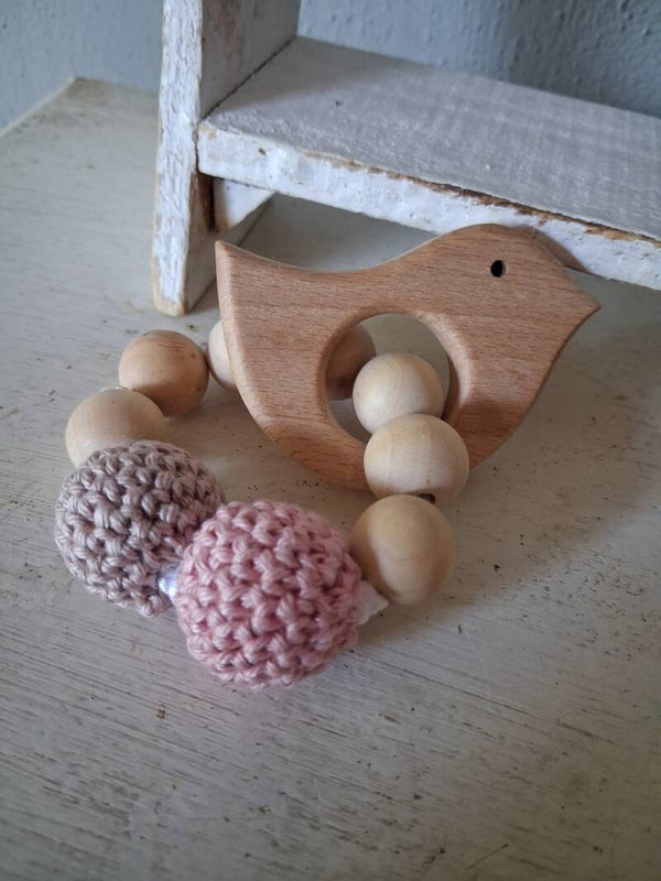 Kralenbijtring vogel roze