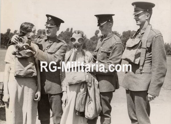 Original WW2 British Press Photo - Grenadier Guards help civilians put on a gasmask, Caterham (1937)