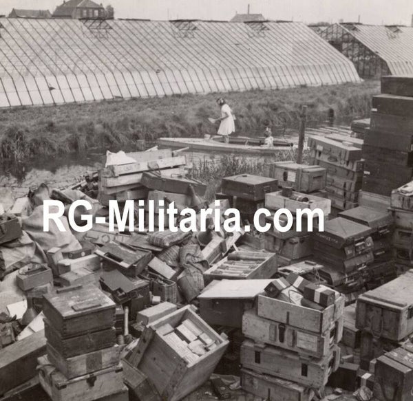 Original WW2 Canadian Press Photo - Collected German ammunition boxes and equipment for the Allied army in Hoek van Holland (1945)