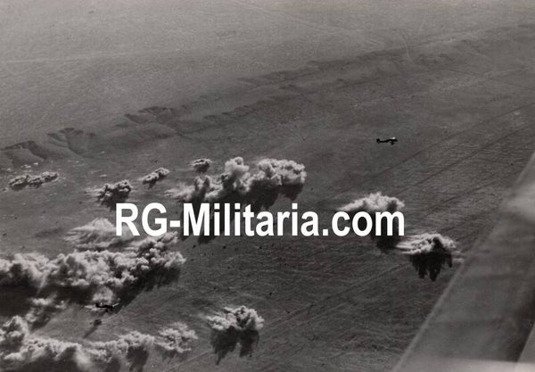 Original WW2 German Press Photo - Luftwaffe Junkers Ju 87 B Stuka airplane bombing British panzer tanks in the desert (19410