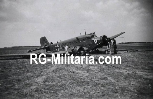 Original WW2 German Photo - Rotterdam airfield Waalhaven with landed Junkers JU 52 airplane with decal IV./KGzbV.1, Holland (1940)