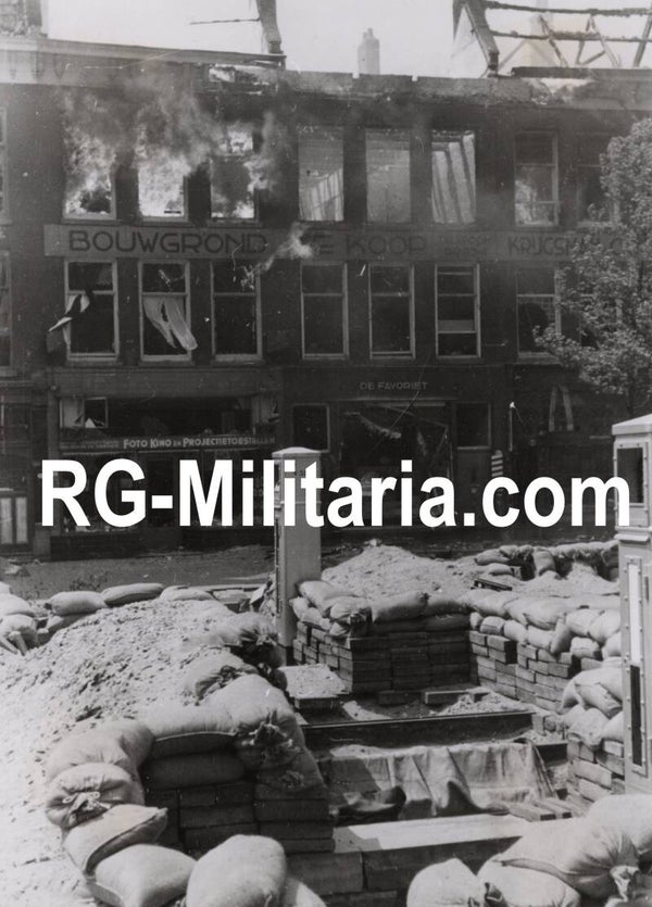 Original WW2 German Press Photo - Burning building in front of an abandoned trench during the bombing of Rotterdam, Holland, May (1940)